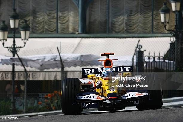 Fernando Alonso of Spain and Renault exits Casino Square while driving during practice for the Monaco Formula One Grand Prix at the Monte Carlo...