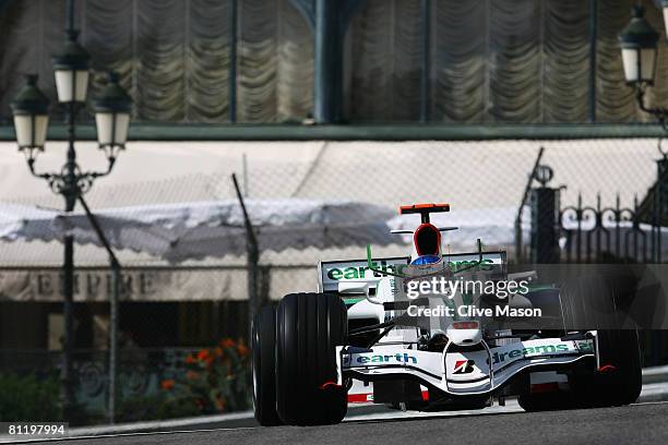 Jenson Button of Great Britain and Honda Racing exits Casino Square while driving during practice for the Monaco Formula One Grand Prix at the Monte...