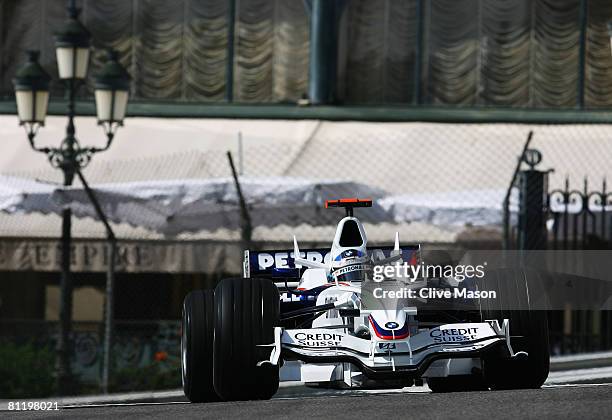 Nick Heidfeld of Germany and BMW Sauber exits Casino Square while driving during practice for the Monaco Formula One Grand Prix at the Monte Carlo...