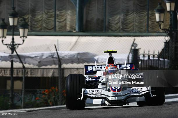 Robert Kubica of Poland and BMW Sauber exits Casino Square while driving during practice for the Monaco Formula One Grand Prix at the Monte Carlo...