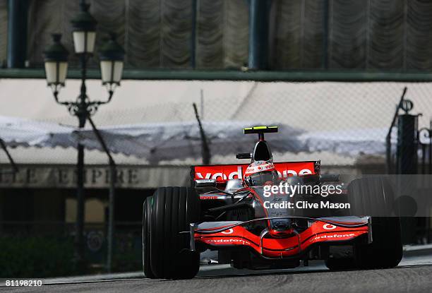 Heikki Kovalainen of Finland and McLaren Mercedes exits Casino Square while driving during practice for the Monaco Formula One Grand Prix at the...