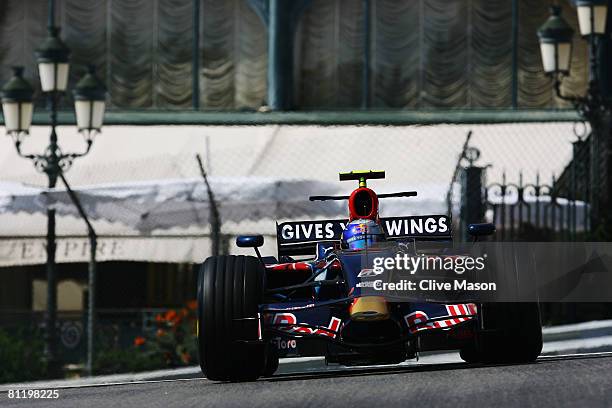 Sebastian Vettel of Germany and Scuderia Toro Rosso exits Casino Square while driving during practice for the Monaco Formula One Grand Prix at the...
