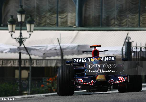 Sebastien Bourdais of France and Scuderia Toro Rosso exits Casino Square while driving during practice for the Monaco Formula One Grand Prix at the...