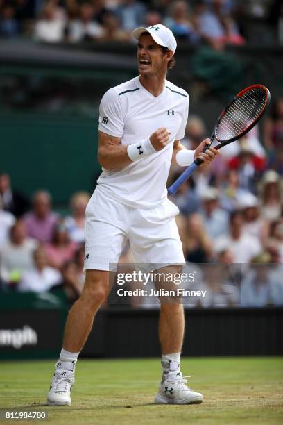 Andy Murray of Great Britain celebrates match point and victory during the Gentlemen's Singles fourth round match against Benoit Paire of France on...