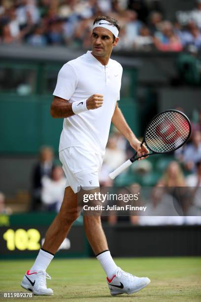 Roger Federer of Switzerland celebrates during the Gentlemen's Singles fourth round match against Grigor Dimitrov of Bulgaria on day seven of the...