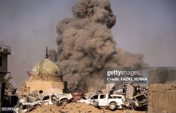 Picture taken on July 10 shows smoke plumes billowing in the Old City of Mosul during the offensive by the Iraqi force to retake the embattled city...