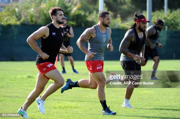 Toulon's French fullback Hugo Bonneval , RC Toulon's New Zealand flyhalf Luke McAlister and RC Toulon's New Zealand centre Ma'a Nonu take part in a...