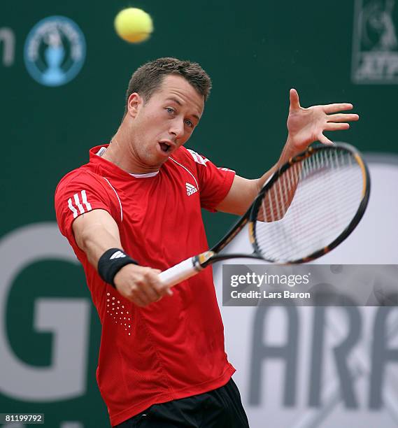 Philipp Kohlschreiber of Germany plays a backhand during his match against Igor Andreev of Russia during day five of the ARAG World Team Cup at the...