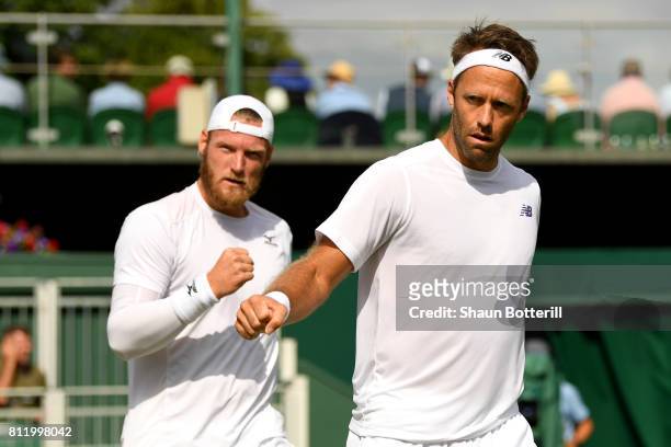 Robert Lindstedt of Sweden and Sam Groth of Australia celebrate during the Gentlemen's Doubles third round match against Nikola Mektic of Croatia and...