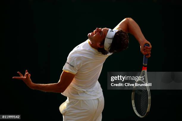 Dominic Thiem of Austria serves during the Gentlemen's Singles fourth round match against Tomas Berdych of The Czech Republic on day seven of the...
