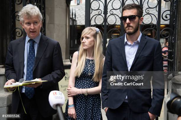 Chris Gard and Connie Yates, the parents of terminally ill toddler Charlie Gard, listen as family friend, Alasdair Seton-Marsden , addresses the...