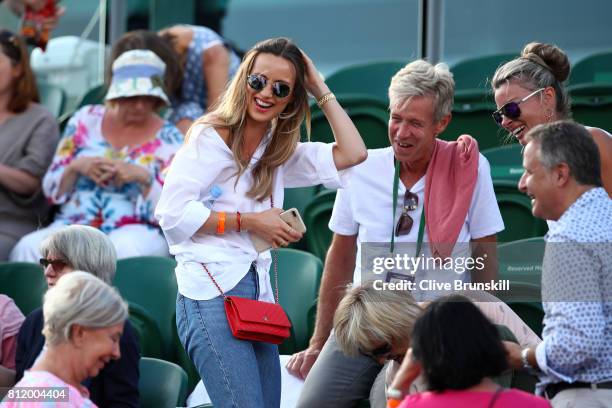 Ester Satorova wife of Tomas Berdych and his father Martin Berdych look on after his Gentlemen's Singles fourth round match victory against Dominic...