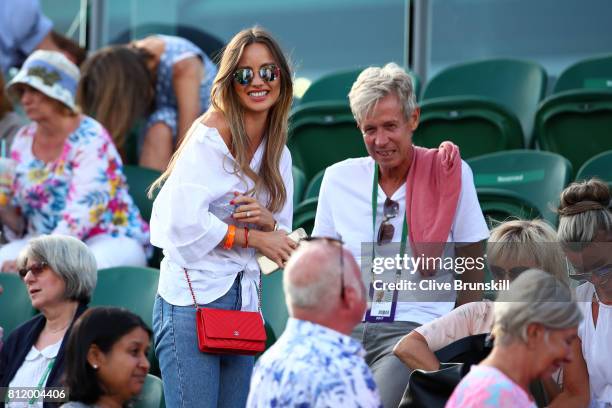Ester Satorova wife of Tomas Berdych and his father Martin Berdych look on after his Gentlemen's Singles fourth round match victory against Dominic...