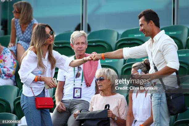 Ester Satorova wife of Tomas Berdych and his father Martin Berdych look on after his Gentlemen's Singles fourth round match victory against Dominic...