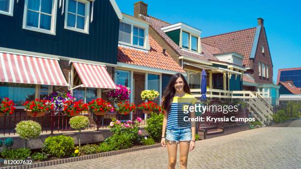 teenage girl smiling in volendam, netherlands - volendam stock pictures, royalty-free photos & images