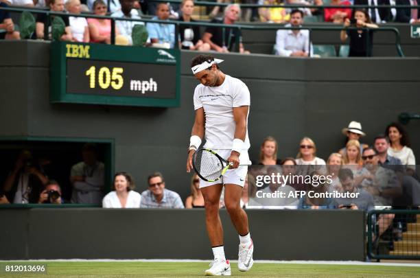 Spain's Rafael Nadal reacts against Luxembourg's Gilles Muller during their men's singles fourth round match on the seventh day of the 2017 Wimbledon...