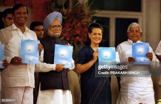 Indian Prime Minister Manmohan Singh , United Progressive Alliance Chairperson Sonia Gandhi , Railway Minister Laloo Prasad Yadav and T. R. Balu pose...