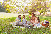 Healthy Family enjoying summer picnic in the nature