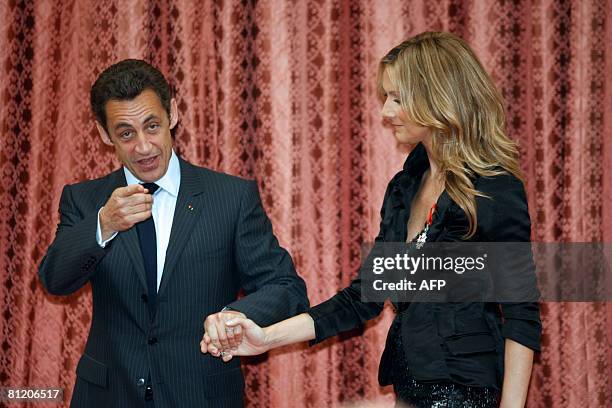 Canadian singer Celine Dion stands next to French President Nicolas Sarkozy after she was awarded with the France's Legion d'Honneur during a...