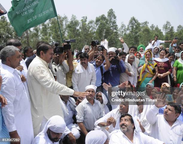 Leader Abhay Chautala along with party workers protesting over the Satluj-Yamuna Link canal issue near Punjab-Haryana border on July 10, 2017 in...