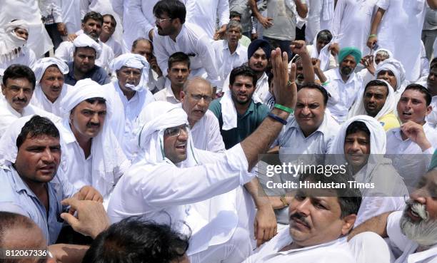 Dushyant Choutala along with party workers protesting over the Satluj-Yamuna Link canal issue near Punjab-Haryana border on July 10, 2017 in Ambala,...