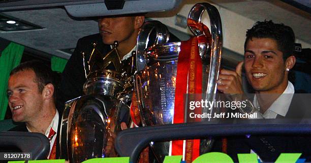 Wayne Rooney and Cristiano Ronaldo arrive back from Moscow after their win over Chelsea in the Champions League final May 22, 2008 in Manchester,...