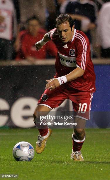 Cuauhtemoc Blanco of the Chicago Fire brings the ball up the field against the Houston Dynamo during the second half at Toyota Park on May 17, 2008...