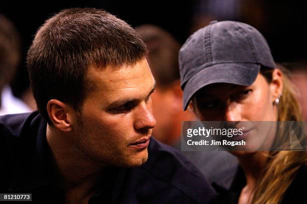Tom Brady of the New England Patriots and Gisele Bundchen watch as the Detroit Pistons play against the Boston Celtics during Game Two of the 2008...