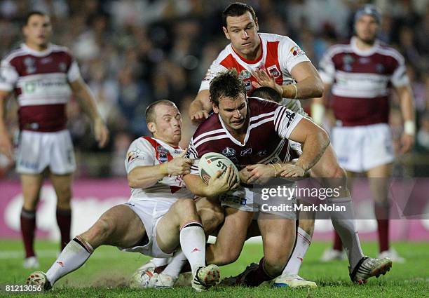 Josh Perry of the Eagles is tackled during the round 11NRL match between the Manly Warringah Sea Eagles and the St George Illawarra Dragons at...
