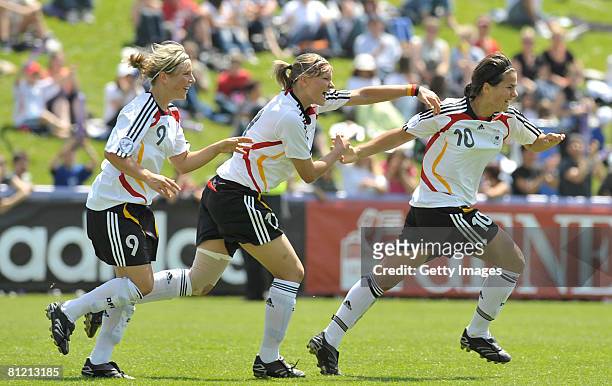 Svenja Huth, Alexandra Popp and Dzsenifer Marozsan of Germany celebrate after scoring during the UEFA Women's U17 European championship match between...