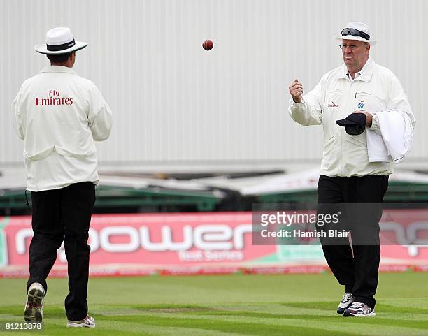 Umpire Darrell Hair tosses the ball to fellow umpire Simon Taufel to have it replaced during the first day of the 2nd npower Test Match between...