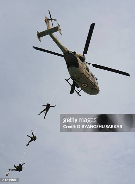 Indian army officers participate in a helicopter rescue drill during a visit by the Sultan Hazi Hassanal Bolkiah of Brunei Darussalam at the...