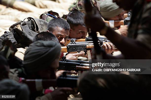 Newly recruited Indian army officers participate in a training session of the Parachute Regiment at a training centre of the Indian Army in Bangalore...