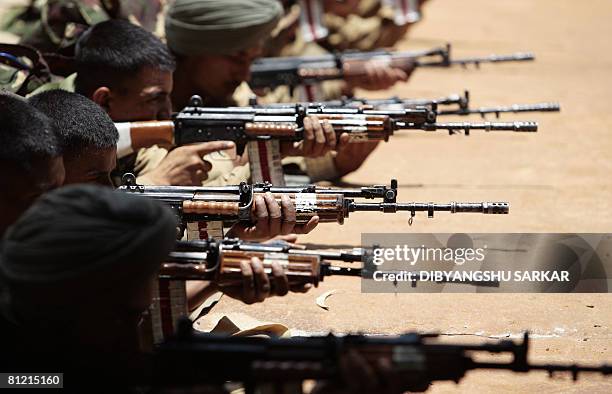 Newly recruited Indian army officers participate in a training session of the Parachute Regiment at a training centre of the Indian Army in Bangalore...