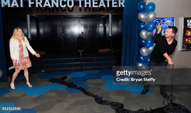 Regional President of the Linq Hotel & Casino Eileen Moore watches as magician Mat Franco pulls down a curtain revealing his namesake theater marquee...