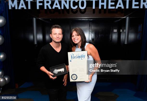 Magician Mat Franco and Tianna Scartabello hold a ceremonial key to the Las Vegas Strip and a proclamation presented to him as part of the ceremony...