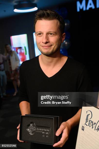 Magician Mat Franco holds a ceremonial key to the Las Vegas Strip presented to him as part of the ceremony renaming the showroom the Mat Franco...