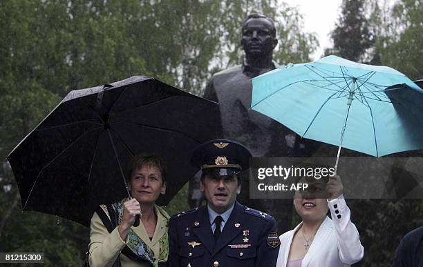 Astronauts Yury Malenchenko of Russia , Peggy Whitson of the US and South Korean Yi So-Yeon have their picture taken near a statue of Yuri Gagarin...