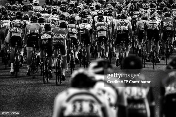 The pack rides during the 213,5 km seventh stage of the 104th edition of the Tour de France cycling race on July 7, 2017 between Troyes and...