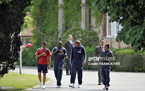 France football team's Franck Ribery, Thierry Henry and Eric Abidal arrive to attend a press conference in Clairefontaine, southern Paris, on May 23...