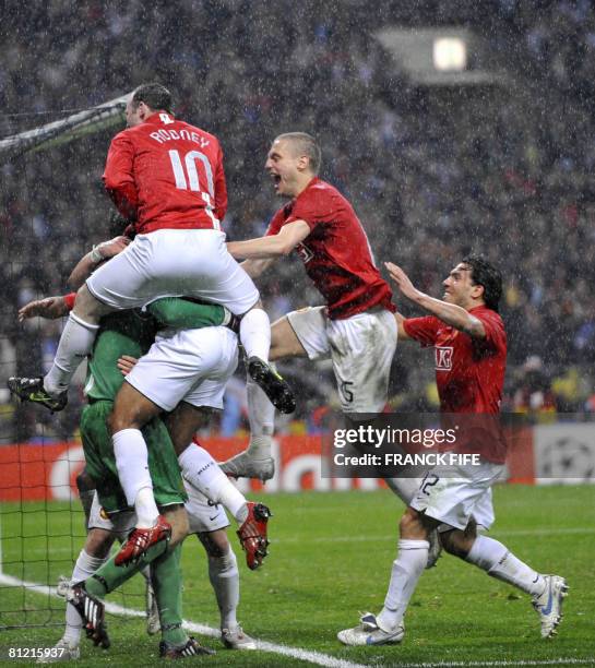 Manchester United players celebrate after Dutch goalkeeper Edwin van der Sar saved a penalty by Chelsea's French forward Nicolas Anelka to win the...