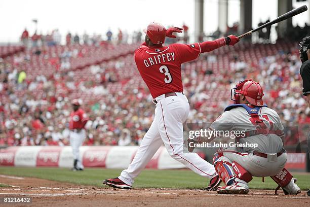 Ken Griffey, Jr. Of the Cincinnati Reds hits a home run during the game against the Philadelphia Phillies at Great American Ball Park in Cincinnati,...