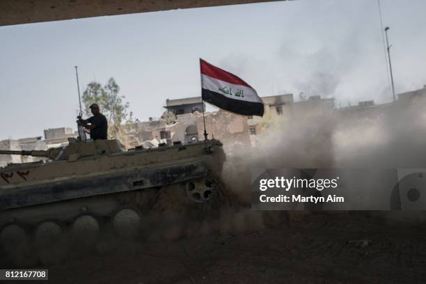 An Iraqi Army tank on the bank of the Tigris River where they fight Islamic State militants who occupy the last section of the Old City district on...
