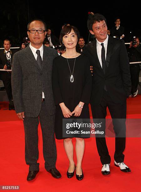 Director Chung Mong-Hong, guest and actor Chen Chang arrive for the "Il Divo" premiere at the Palais des Festivals during the 61st International...