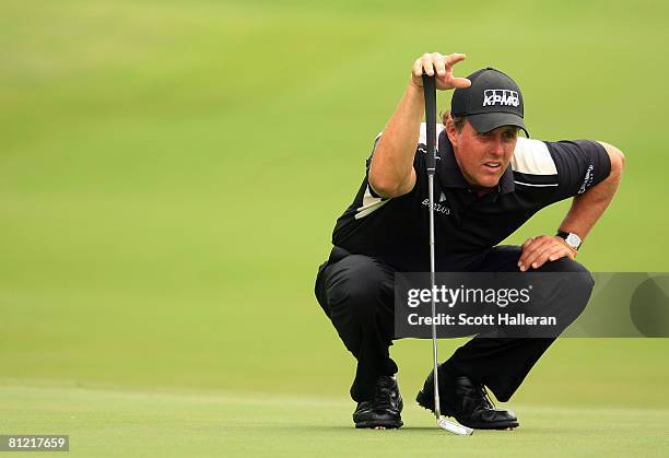 Phil Mickelson lines up a putt on the sixth green during the second round of the Crown Plaza Invitational at the Colonial Country Club on May 23,...