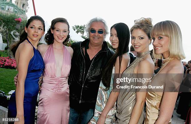 Flavio Briatore pose with models as he attends the 'Better World Awards' cocktail reception held at the Hotel de Paris on May 23, 2008 in Monte...