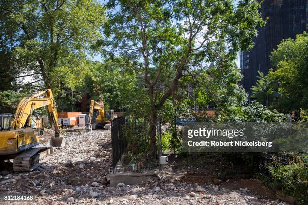 Heavy machinery lies idle on the site where a 15-story residential building will be located July 7, 2017 in Brooklyn, New York. A small public park,...