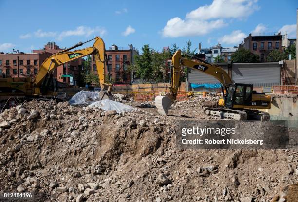 Heavy machinery lies idle on the site where a high-rise residential building will be built July 7, 2017 in Brooklyn, New York. The building site is...