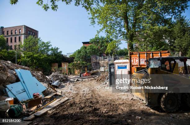 Heavy machinery lies idle on the site where a 15-story residential building will be located June 14, 2017 in Brooklyn, New York. The building site is...