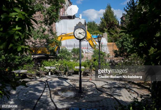 Heavy machinery lies idle on the site behind a public park where a 15-story residential building will be located July 7, 2017 in Brooklyn, New York....
